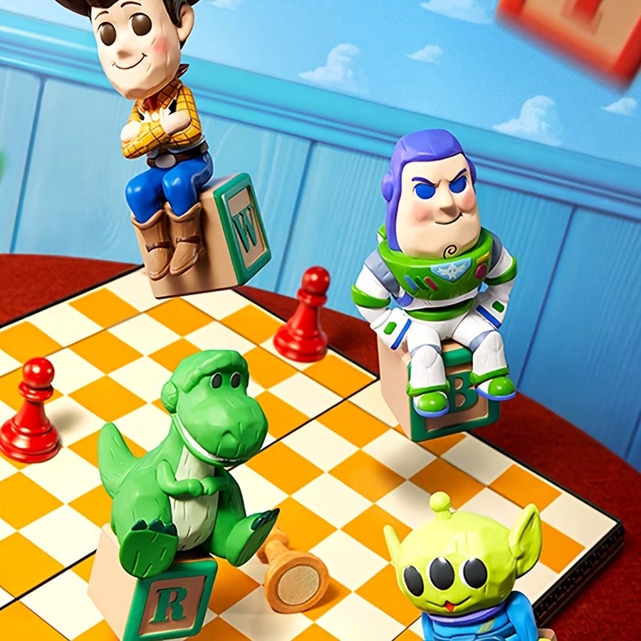 Toy Story 30th commemorative Ludo blind box figurines featuring Woody, Buzz Lightyear, Rex, and Alien seated on alphabet blocks.