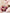 MINISO Disney Pixar Toy Story Lotso strawberry plush cuddled in a bedtime setting
