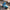 Disney Angel wearing sunglasses in a blue race car figure