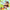 Crayon Shinchan dressed as a brown monkey holding a banana while revealing tushie detail