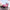 Disney Angel character driving a light pink race car convertible keycap figure