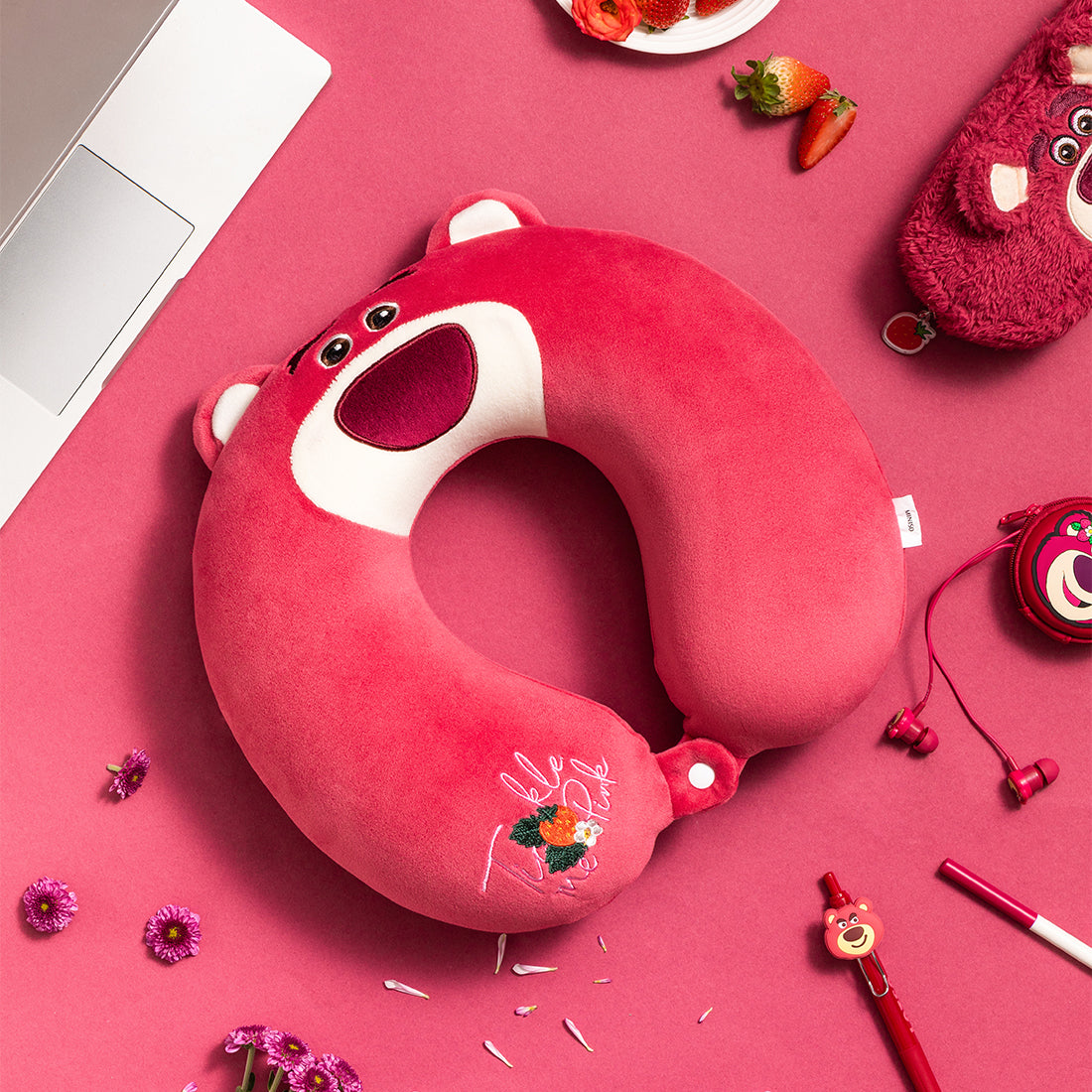 MINISO Lotso series U-shaped neck pillow flat lay shot on pink decorative background