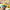 MINISO Minions Stuart 9-inch plush toy held in hand beside books in a cozy room
