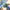 MiNISO Disney Stitch Five More Minutes Sneaky Peek figure lying on bedroom bed