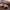 MINISO Disney Stitch in red sunglasses driving a red race car convertible keycap figure