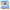 Fuzzy flocked Stitch collectible figures posing in a colorful Disney beach adventure scene