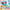 Close-up of the secret Super Future figure from the WAKUKU Fuzzy Trend Party Series wearing oversized pink sunglasses and a fuzzy blue outfit.